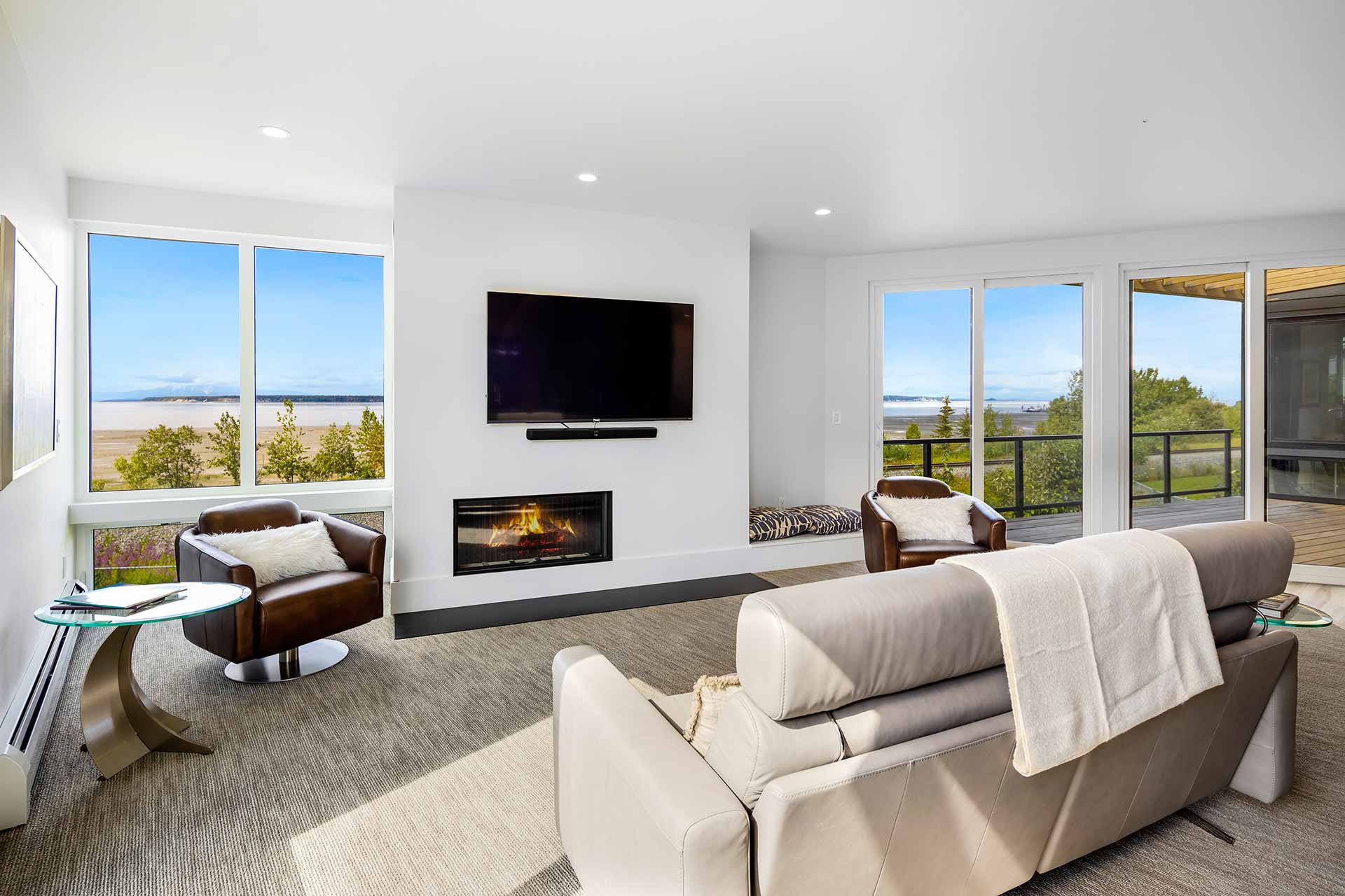 Luxury living room with fireplace at Villa at Bootleggers Landing, Anchorage Alaska vacation rental